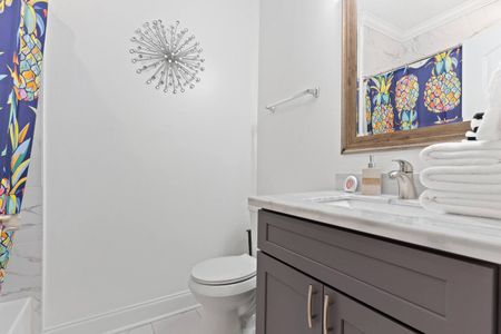 Clean, bright first full bathroom ready for your stay.