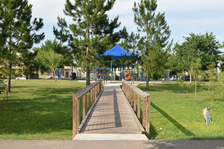 A scenic walkway leads straight to Lafitte Greenway Park.