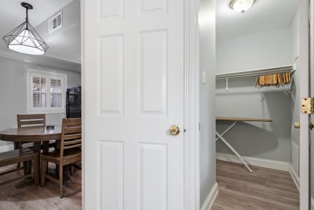 Roomy entryway w/ a classic white door & space to settle in.