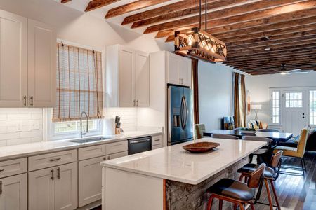 Fully stocked kitchen w/ ample counter space & storage for effortless meal prep.