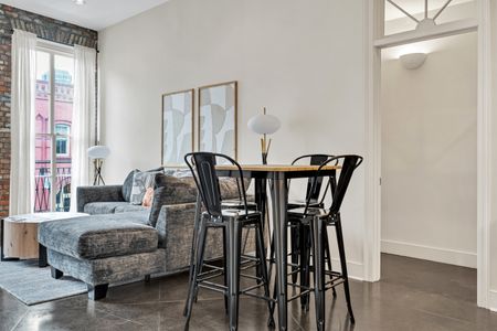 Intimate dining nook w/ modern chairs — perfect for a cozy meal in.