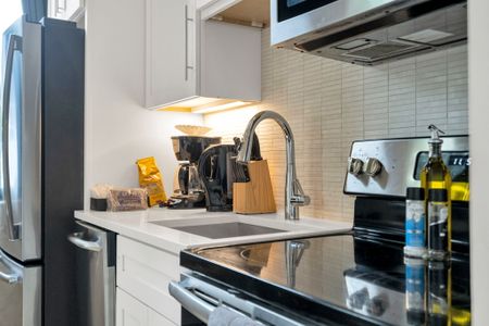 Stainless steel appliances, coffee essentials & cooking tools all within easy reach.