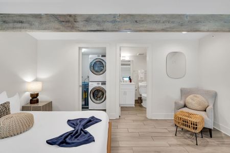 In-unit washer & dryer stacked neatly — laundry made easy during your stay.