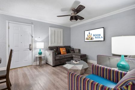 Relaxed lounge space w/ sectional seating & soft, neutral tones.