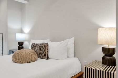 Soft textures, warm lighting & bold design details set the mood for a restful stay.
