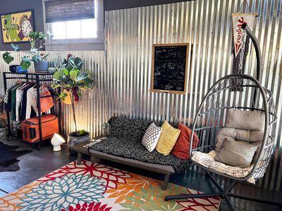 Bright, airy bedroom w/ eclectic decor that feels like a retreat within a retreat.