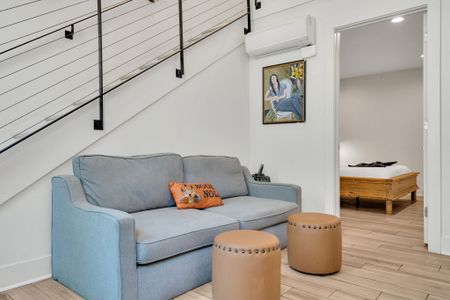 This smartly designed space connects the living room to the bedroom, offering both comfort and privacy for couples or small groups.