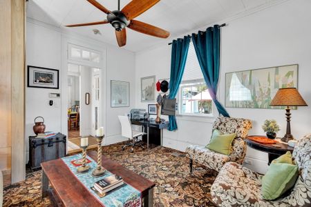 Sunlit living space w/ local flair & vibrant character.