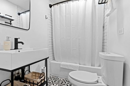 Clean full bathroom attached to the fifth bedroom — convenient & private.