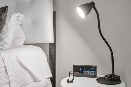 Bedside lamp for easy late-night reading without disturbing the room.