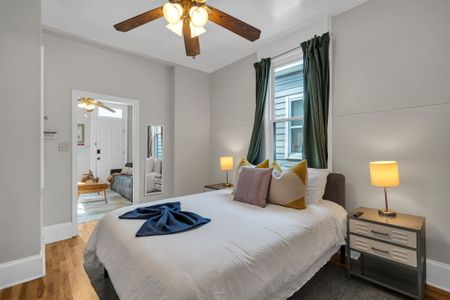Sun-filled bedroom w/ plush pillows & a breezy, relaxed feel.