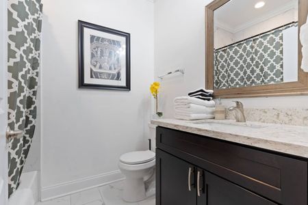 Clean, bright bathroom w/ sink & all the essentials to freshen up.