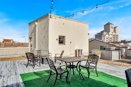Rooftop terrace w/ patio seating — the perfect spot to soak in the city.