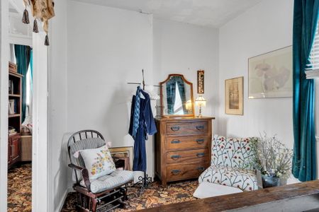 Eclectic bedroom full of local personality & one-of-a-kind charm.