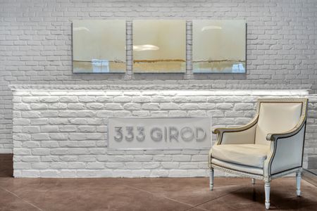 Historic "333 Girod" signage — a nod to the building's storied character.