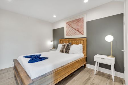 Soft tones & ambient lighting create a calm, relaxing bedroom retreat.