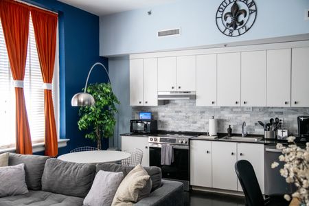 Sleek kitchen & open living space designed for easy mornings & laid-back evenings.