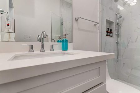 Ensuite master bath sink area w/ a wide vanity & plenty of counter space.