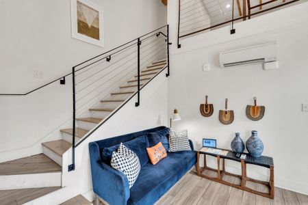 Bright and stylish loft living with local artwork, cozy seating, and all the comforts of home.