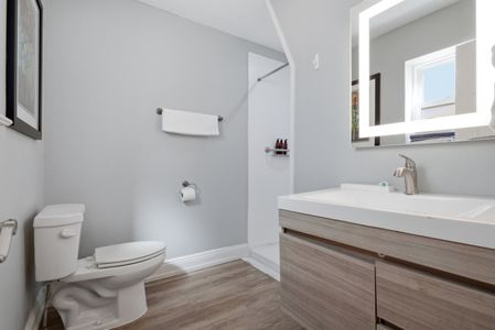 Sleek vanity w/ bright lighting & plenty of counter space to get ready.