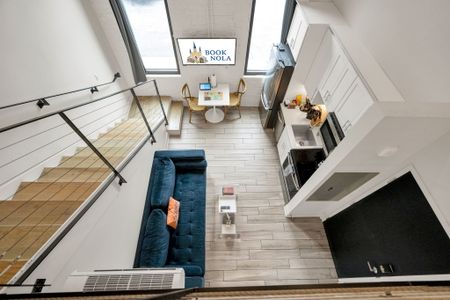 Sunshine pours through grand-paneled windows, filling the living area w/ warmth.
