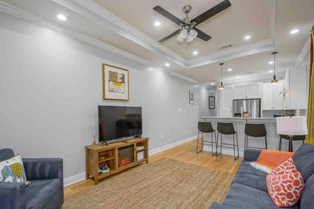 Open living room & kitchen combo — ideal for gathering, cooking, & hanging out together.