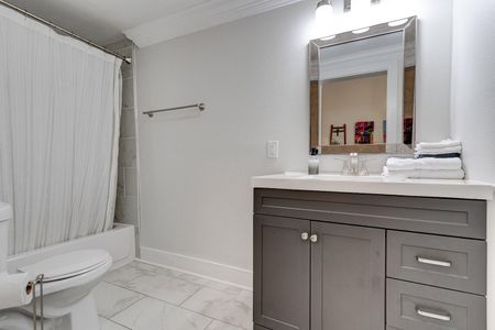 Clean, bright en suite bathroom w/ sink & tub/shower — a private escape after a long day.