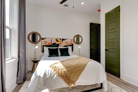 Cozy upstairs bedroom w/ bold décor, warm tones & a stylish flair.