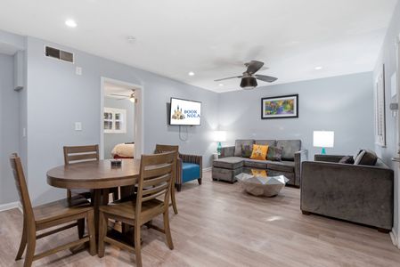 Bright dining area w/ a big table perfect for shared meals