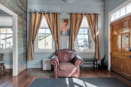 Sunny corner w/ a plush leather chair — the perfect spot to curl up & unwind.