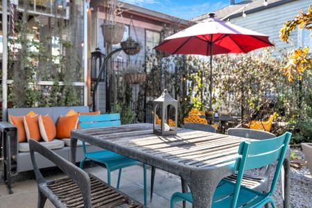 Private courtyard table set for an alfresco meal w/ good company.