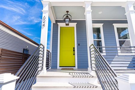 Cheerful yellow front door welcoming you home in style.