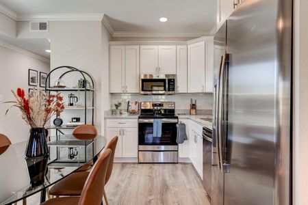 Fully equipped kitchen w/ stainless steel appliances & sleek modern finishes.