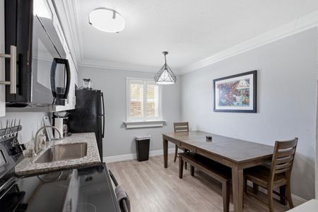 Dining area w/ a wood table — great for gathering over a shared meal.
