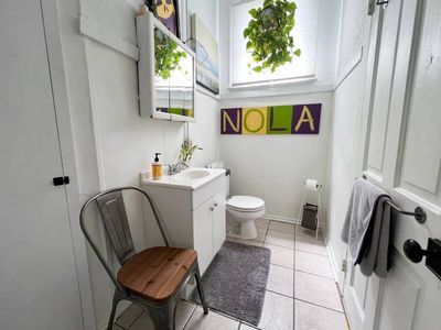 Clean, functional bathroom w/ a sink & all the essentials for a comfortable stay.