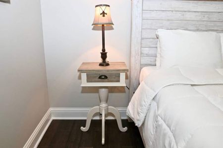 Soft microfiber sheets & a bedside lamp set the mood for restful nights.