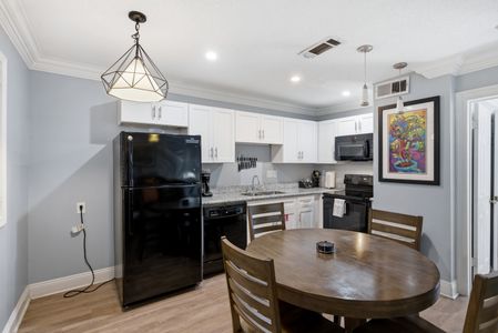 Whip up your favorite meals in this spacious kitchen w/ updated finishes & full appliances.