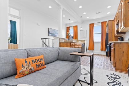 Living room flows into the kitchen — perfect layout for gathering & entertaining.