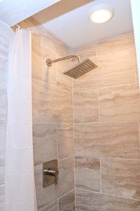 Rinse off under a rain shower head w/ perfect water pressure in the master bath.