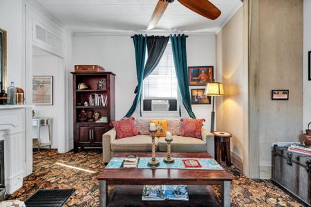 Bright, cozy living room full of classic NOLA charm.