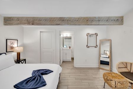 Clean, well-lit bathroom w/ modern fixtures & plenty of space.