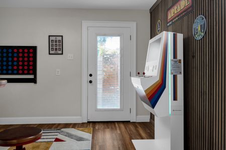 Colorful arcade setup by the entrance — the fun starts before you even settle in.