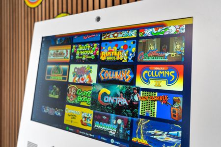 Classic arcade titles line the game room — hours of fun for the whole group.