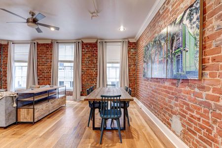 Bright dining area w/ a classic wood table & natural light.