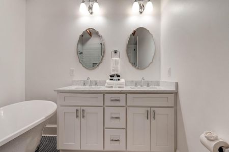 Master ensuite w/ double sinks & generous counter space for two.