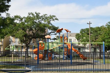 Lafitte Greenway Park just steps away — a vibrant spot for outdoor fun & play.