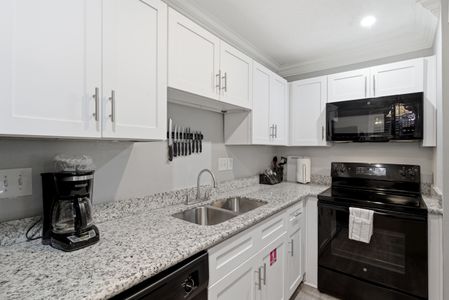 Modern kitchen w/ ample counter space & everything you need for home-cooked meals.