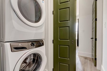 Upstairs laundry room w/ side-by-side washer & dryer for easy convenience.