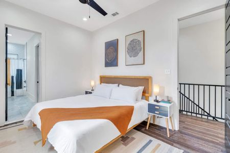 Upstairs king bedroom w/ en-suite bath — bright, warm & private.