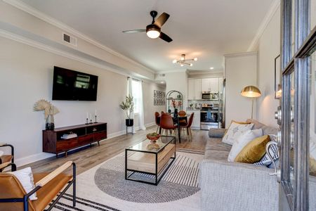 Airy open-concept living area w/ modern furnishings & natural light.
